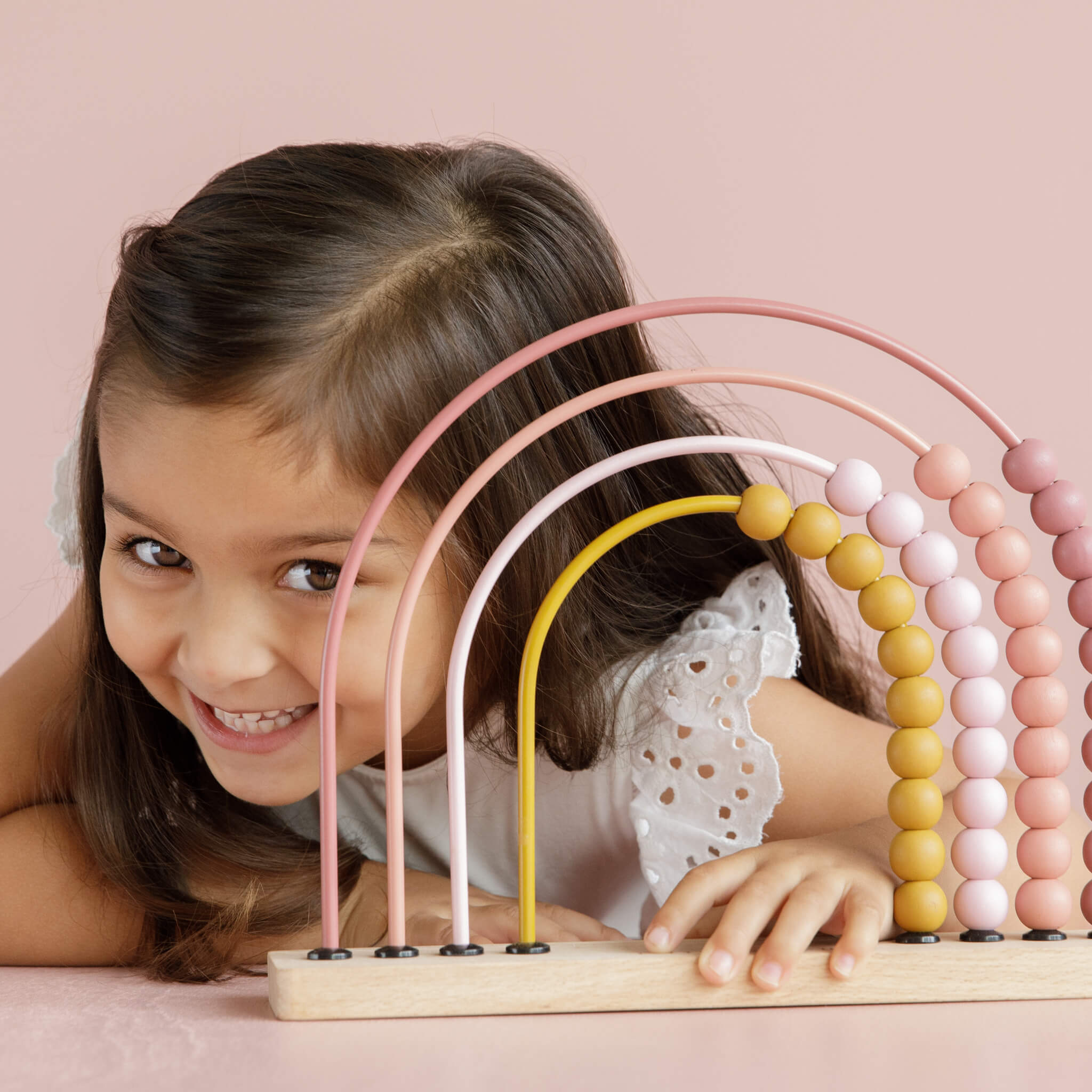 Girl with Little Dutch Rainbow Abacus Toy in Pink 
