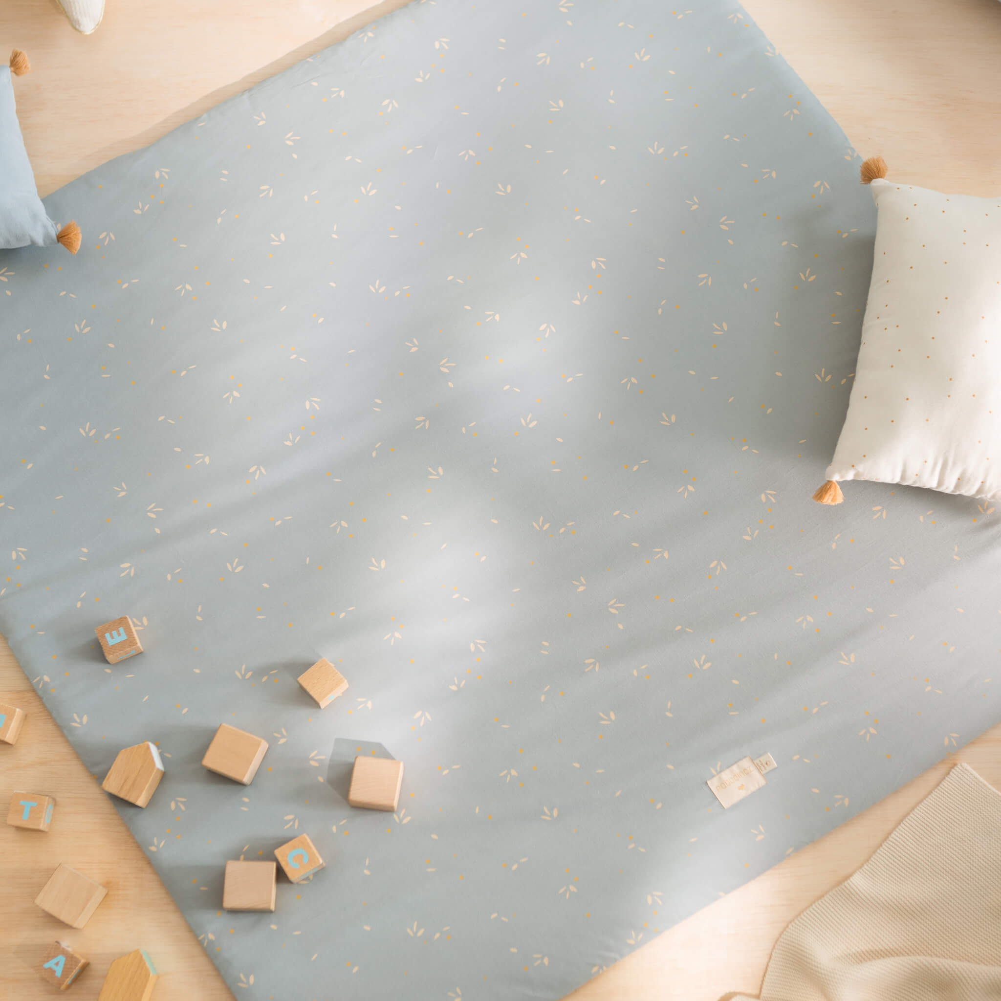 Nobodinoz Colorado Square Playmat in Willow Soft Blue with Toys & Cushions