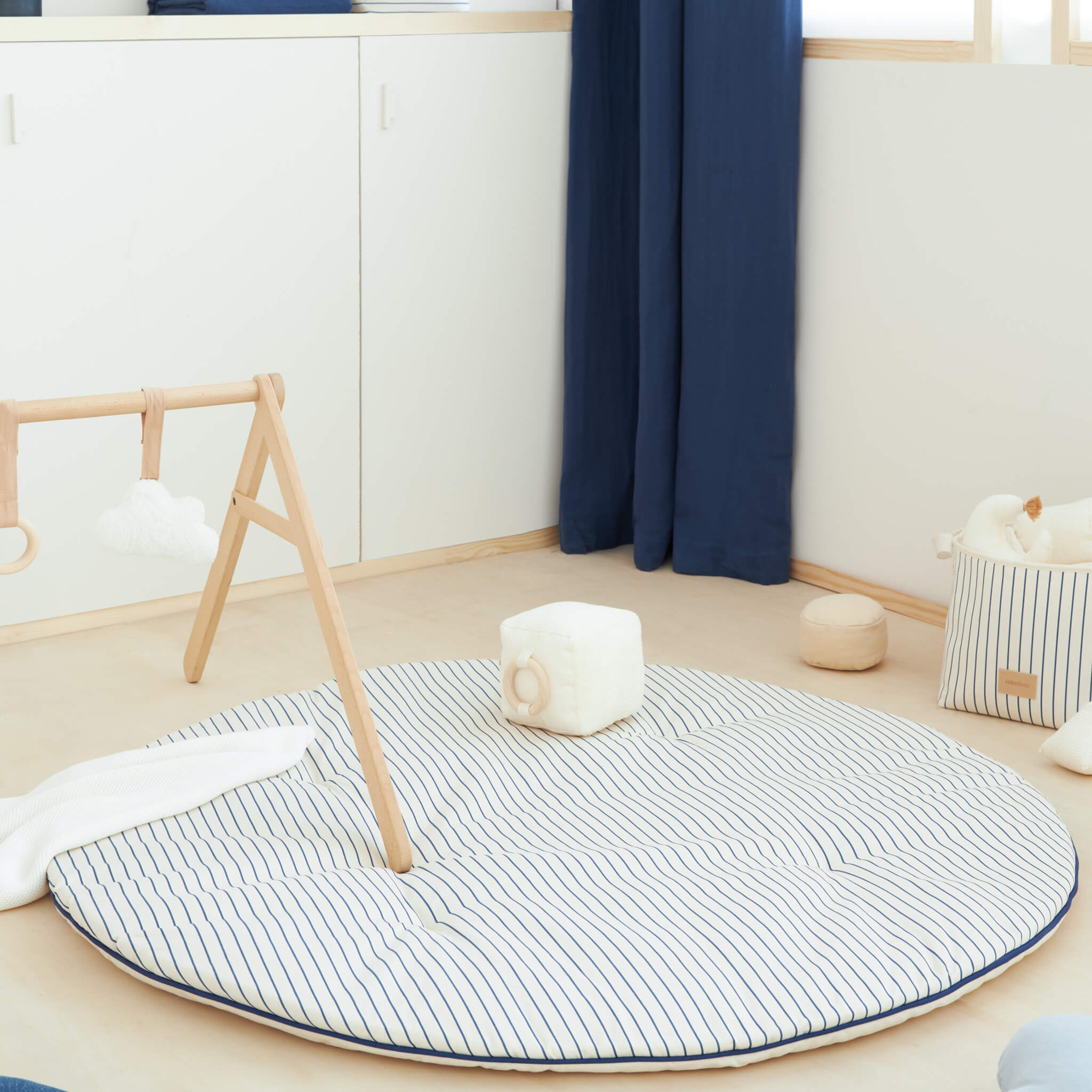 Nobodinoz Fluffy Round Playmat in Blue Stripes in Room