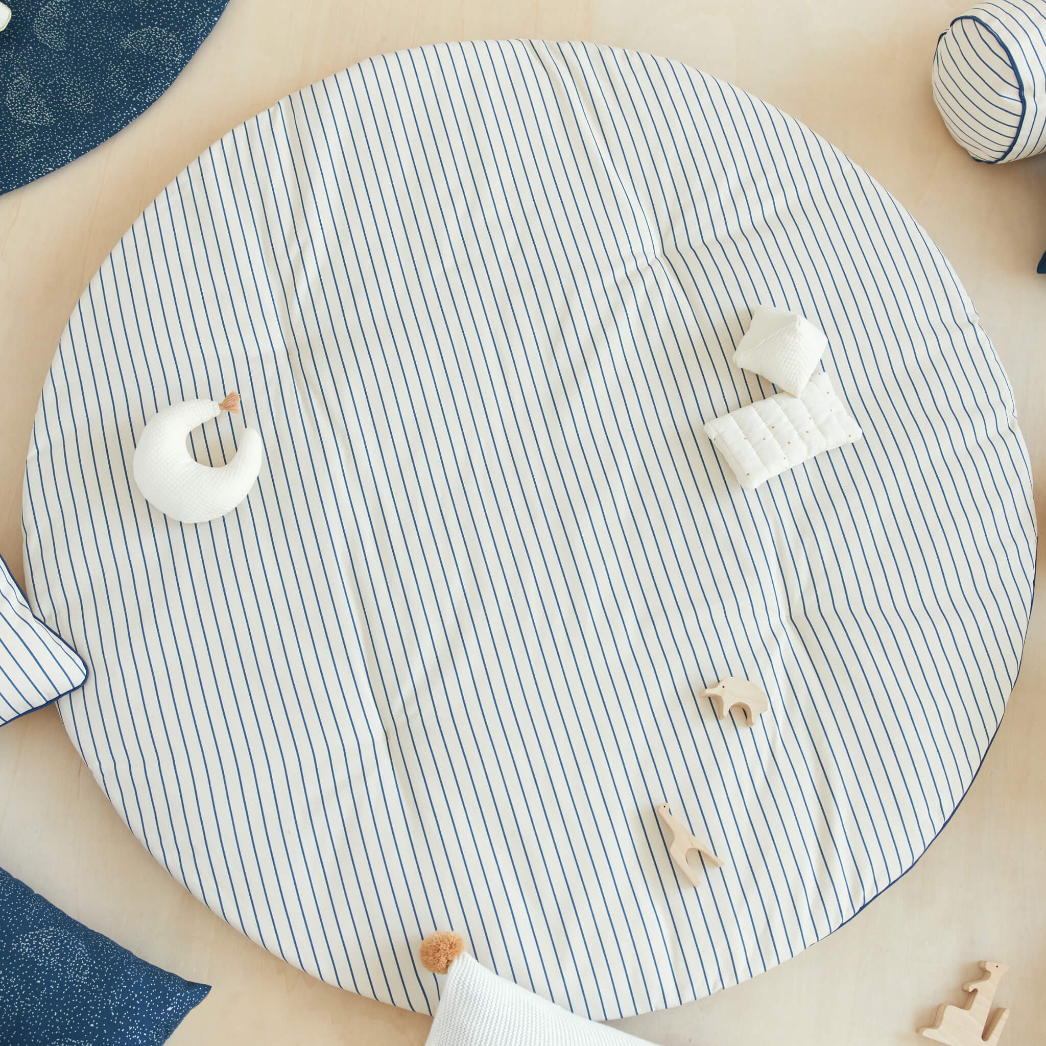 Nobodinoz Fluffy Round Playmat in Blue Stripes with Toys