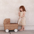 Olli Ella Strolley Toy Pram in Natural with Girl