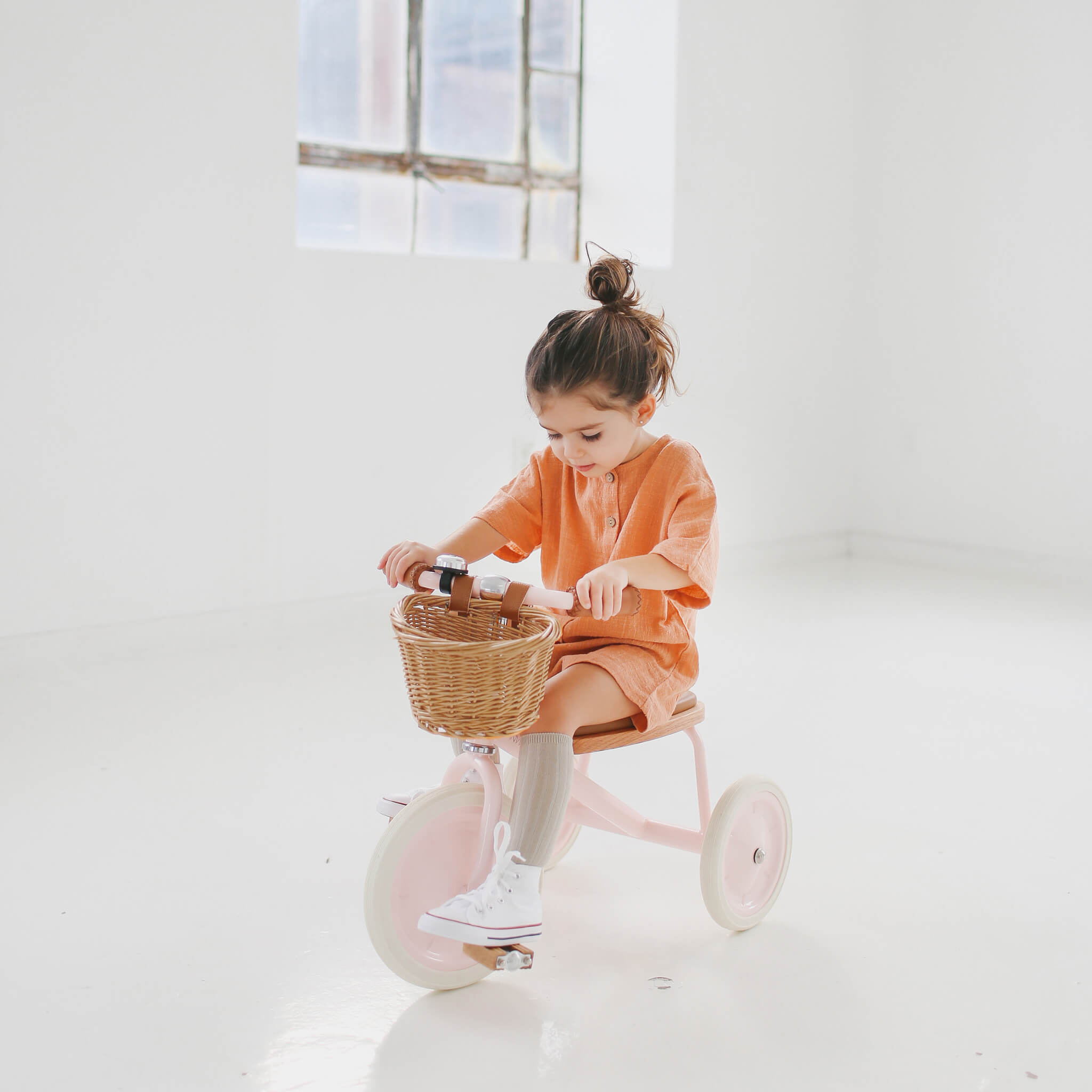 Girl on Banwood Children's Trike in Pink